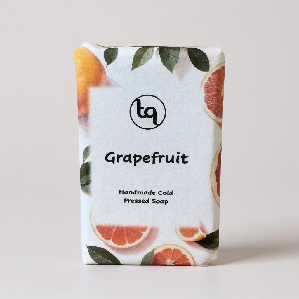 Truequest Grapefruit soap bar with packaging featuring grapefruit slices and leaves on a light gray background.