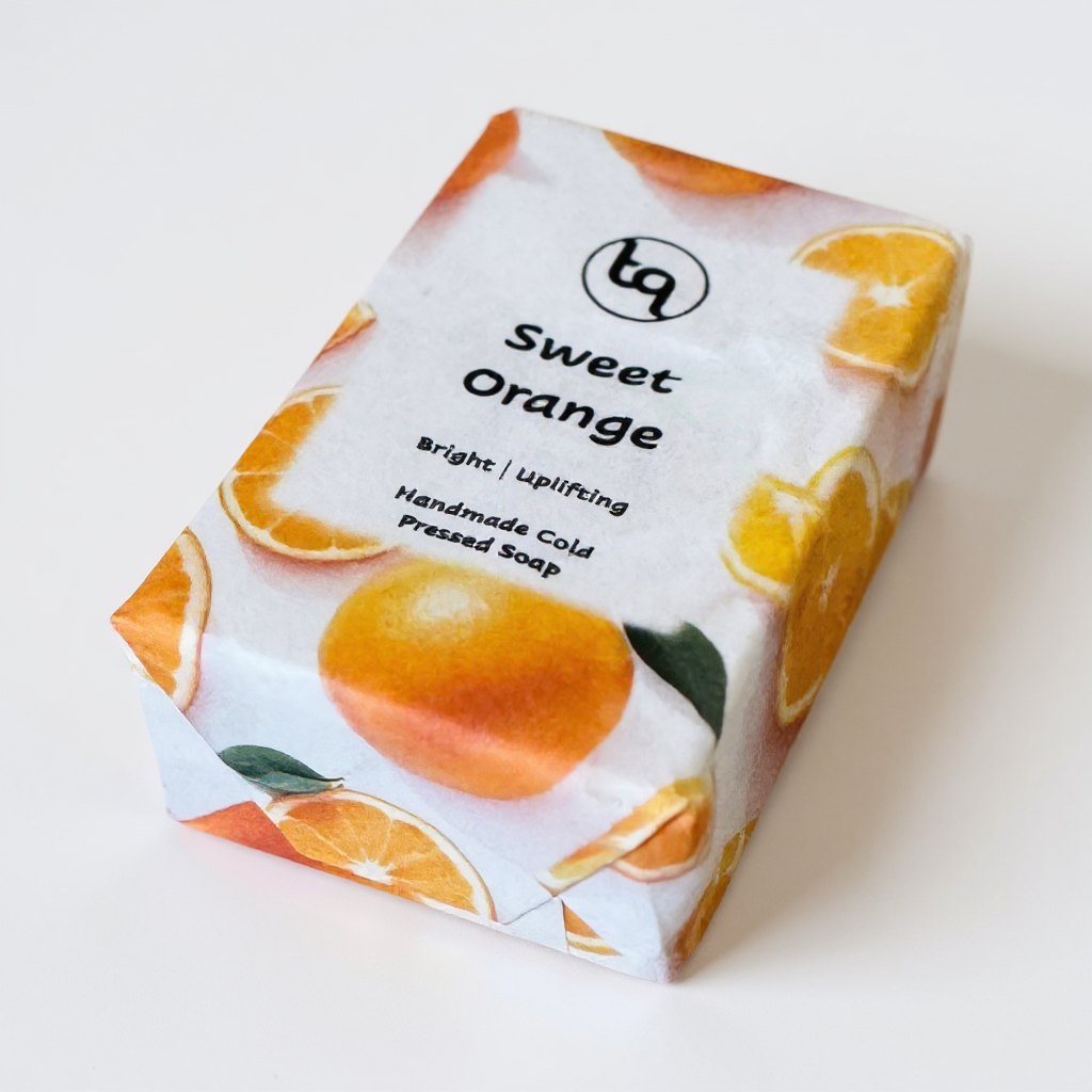 Soap bar with 'Sweet Orange' packaging on a white background