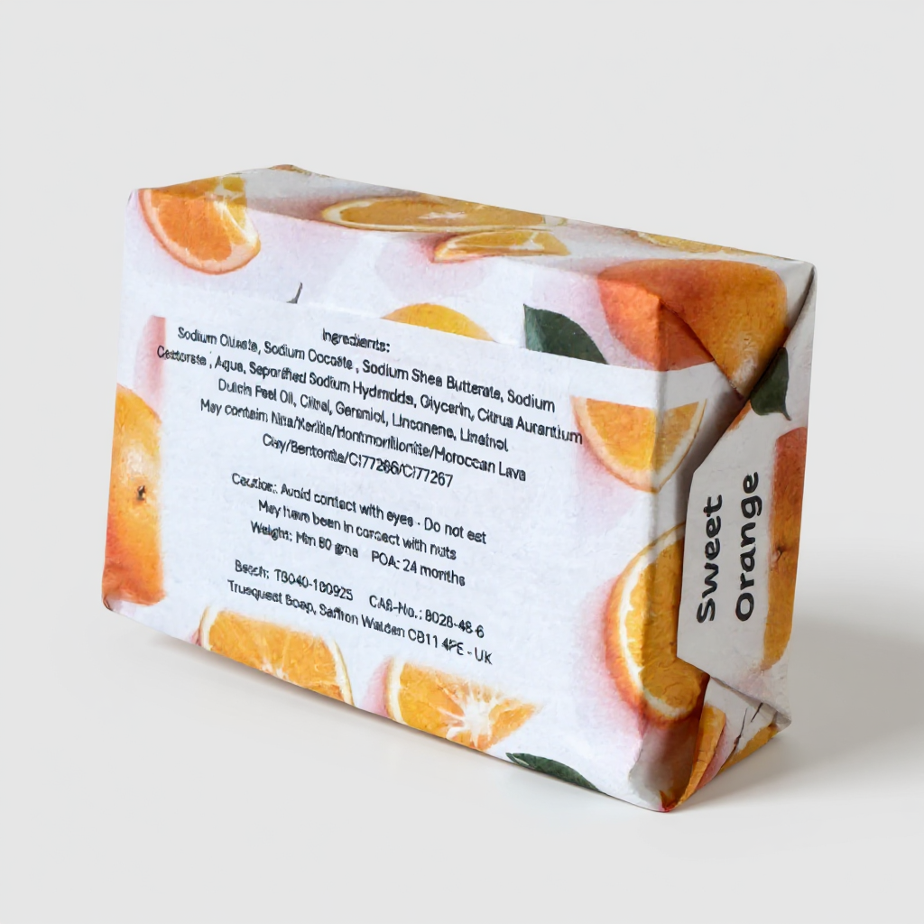 Bar of Truequest soap with orange slices design on a white background