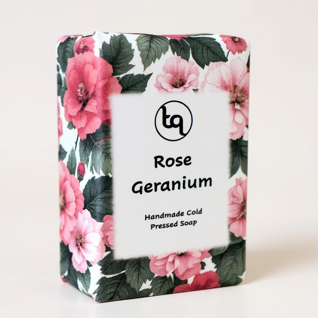 Rose Geranium soap bar with floral packaging on a white background