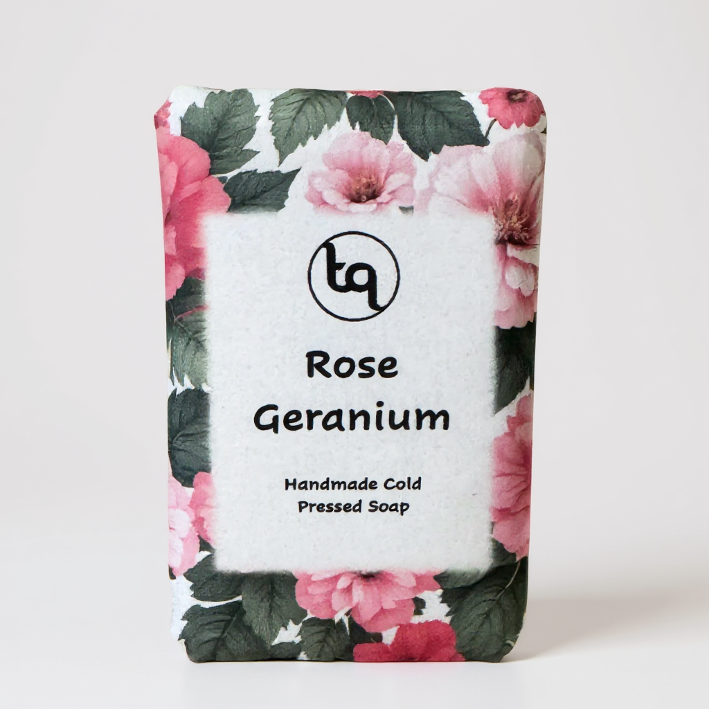 Rose Geranium soap bar with floral packaging on a white background