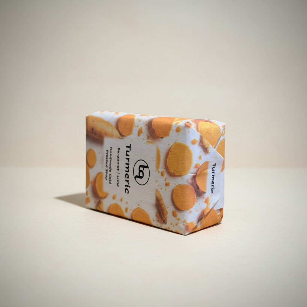 Truequest turmeric cold-pressed soap bar shown resting on its side