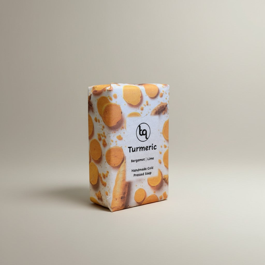 Front view of a Truequest turmeric cold-pressed soap bar