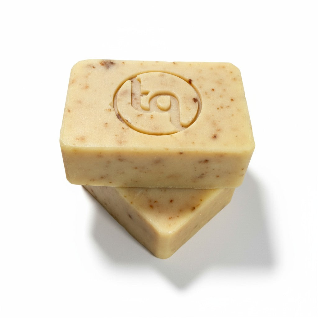 A product photograph of two unwrapped Truequest red cabbage cold-pressed soap bars, displaying their unique natural colour and rustic handmade textures from different angles