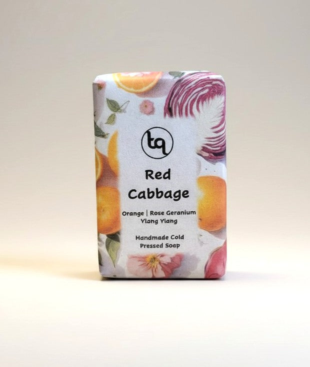 The main product photograph of an unwrapped Truequest red cabbage cold-pressed soap bar