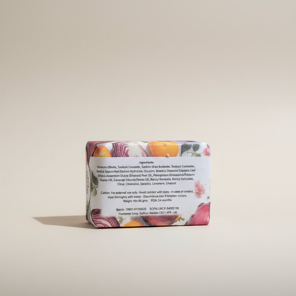 The reverse view of a paper-wrapped Truequest red cabbage cold-pressed soap bar, highlighting the back packaging label where the ingredients list is clearly legible.