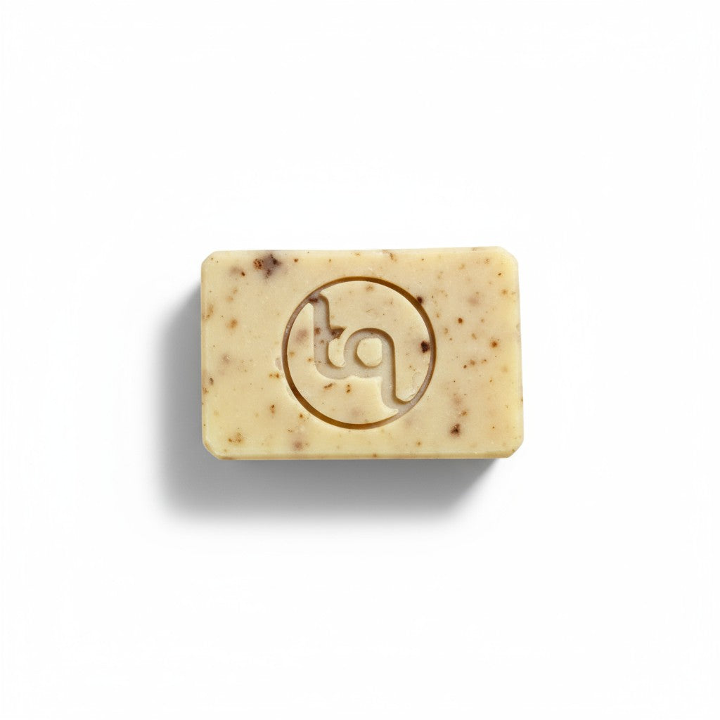 A top-down view of an unwrapped Truequest red cabbage cold-pressed soap bar lying flat, showcasing its smooth front surface and unique natural colour