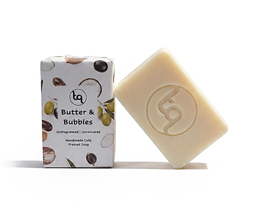 Bar of soap and its packaging with a visible brand logo on a white background