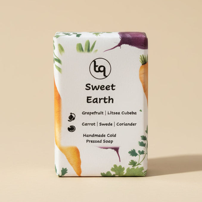 Truequest bar of soap with 'Sweet Earth' on scented with grapefruit and litsea cubeba essential oils a beige background