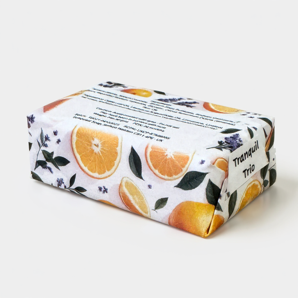Truequest bar of soap with orange slices and leaves design on a white background