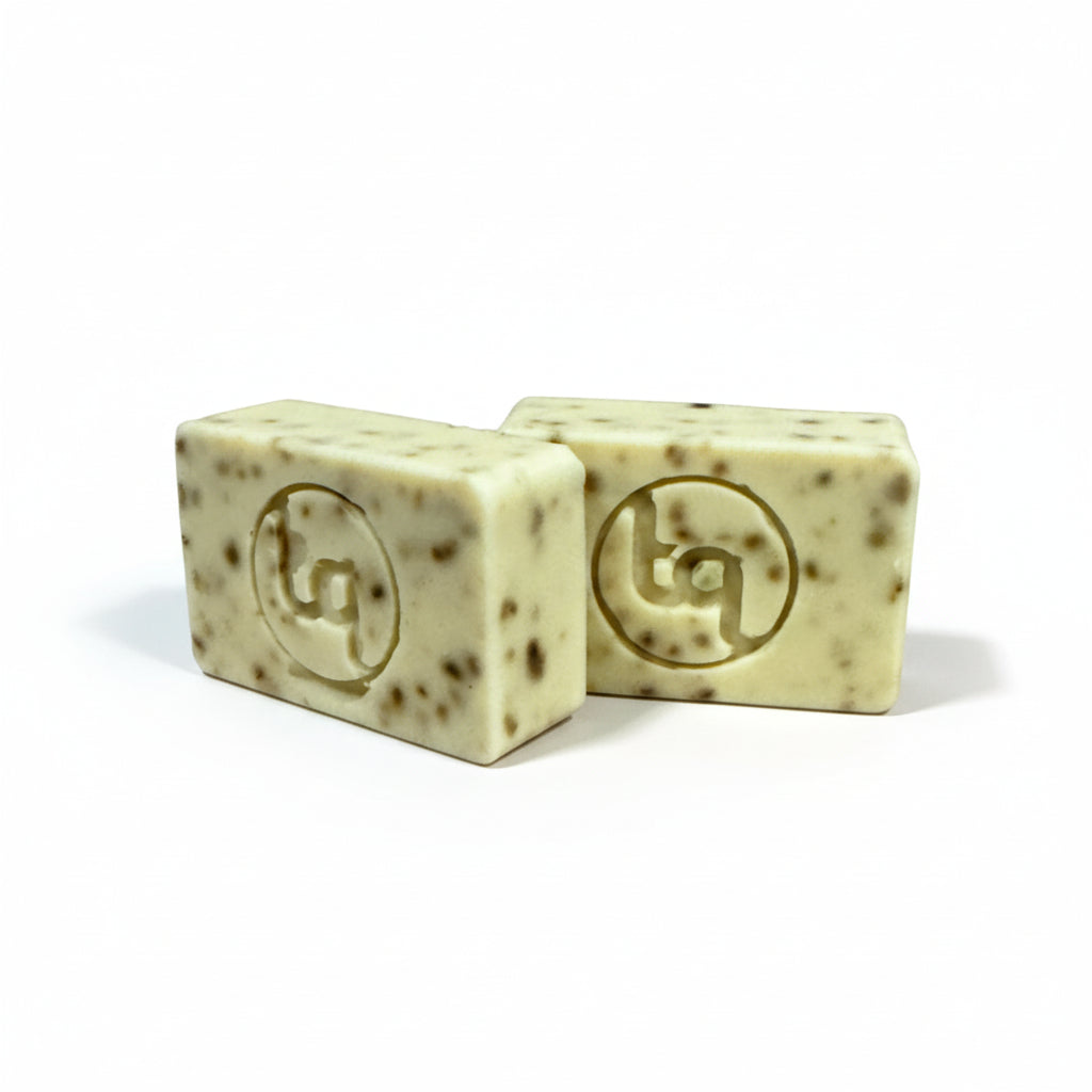 Two Truequest bars of cucumber and mint soap with a logo on a white background