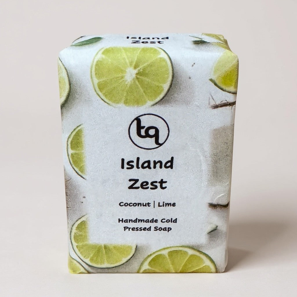 Truequest Island Zest handmade cold-pressed soap bar with coconut and lime scent, featuring lime slices and coconut halves on packaging