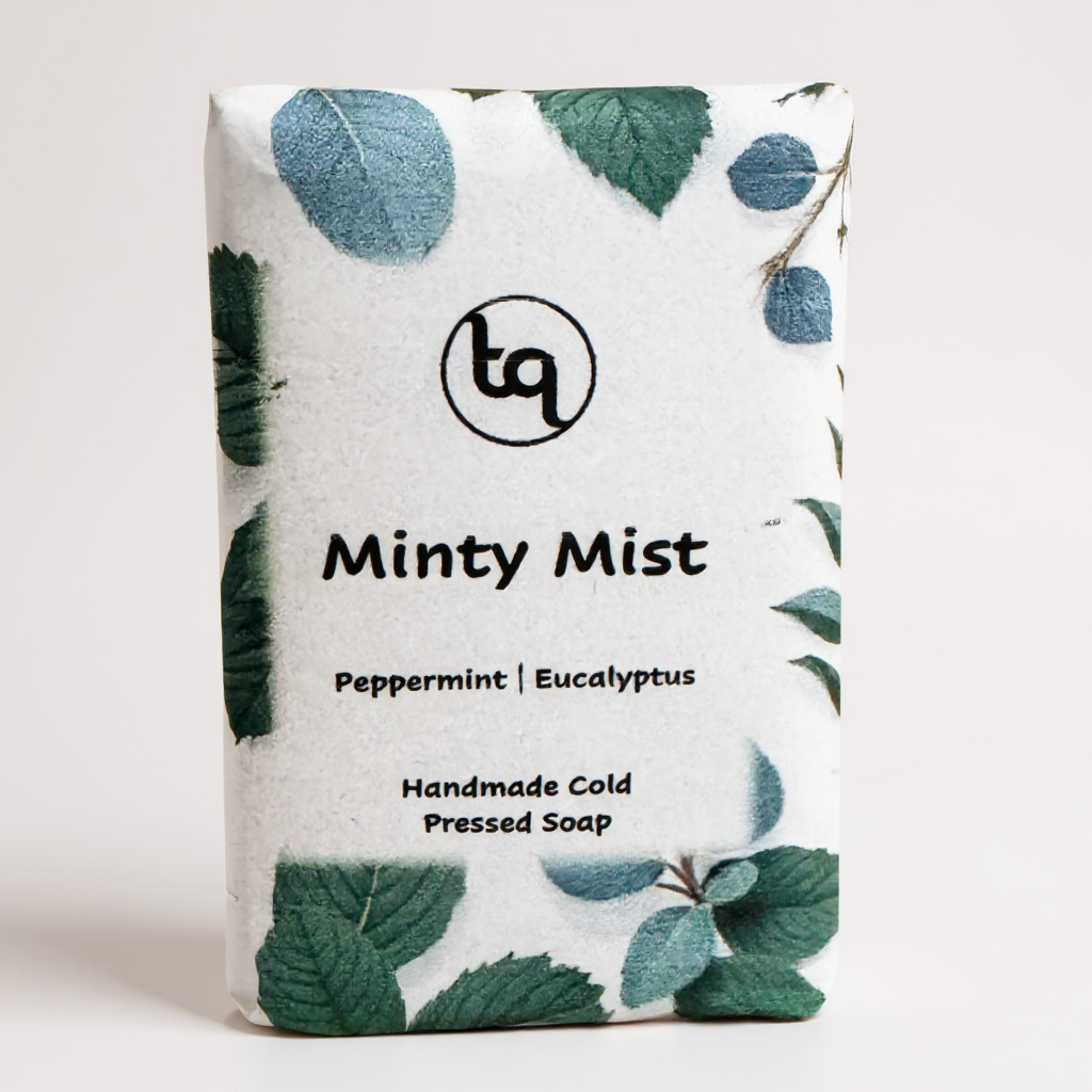 Truequest Minty Mist cold pressed soap wrapped in green leaf patterned paper with peppermint and eucalyptus design.