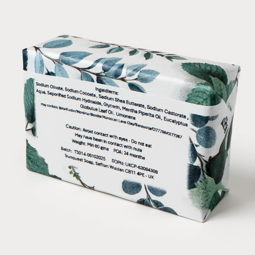 Truequest Minty Mist cold pressed soap wrapped in botanical paper showing the full ingredient list on the back.