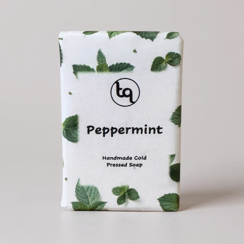 Truequest Peppermint handmade cold-pressed soap bar with mint leaf pattern and logo.