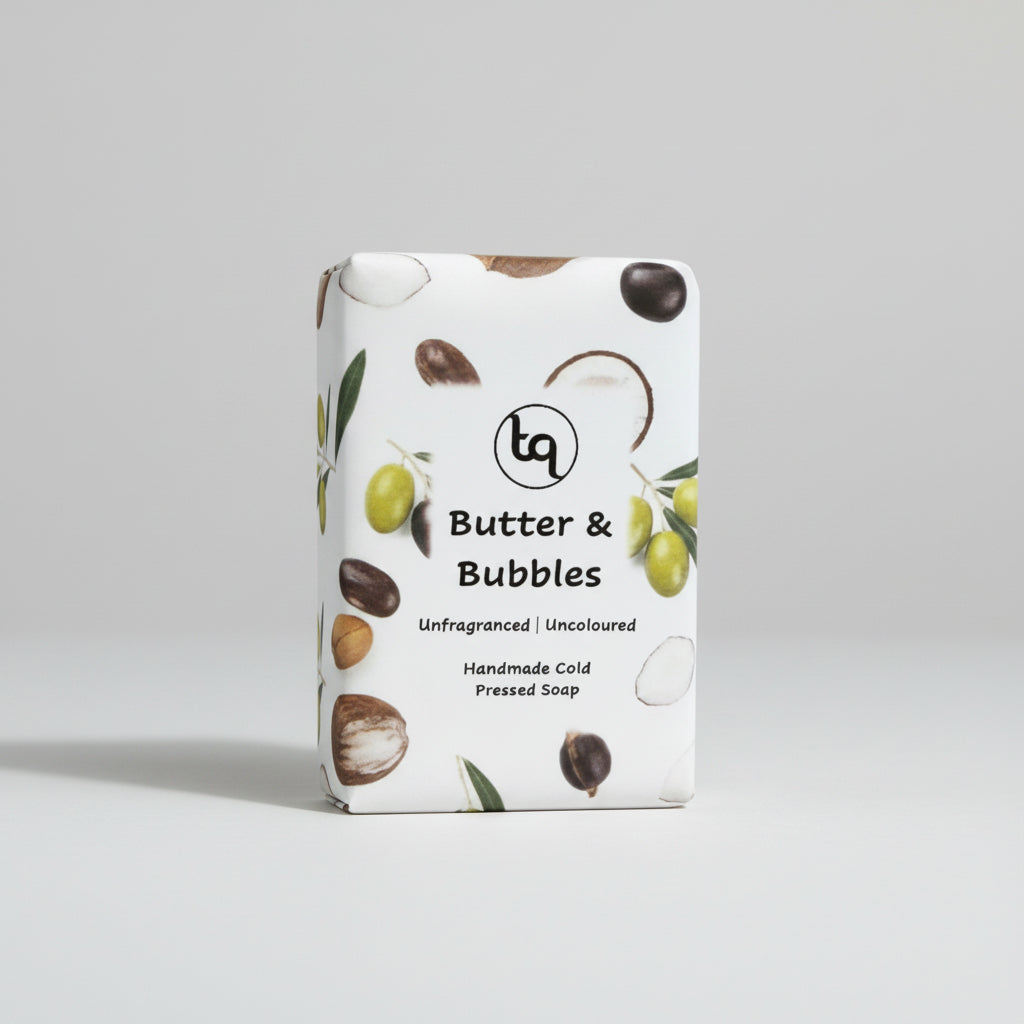 Bar of Truequest soap with 'Butter & Bubbles' packaging on a light gray background
